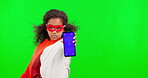 Superhero, phone and mockup with a girl on a green screen background in studio for marketing or advertising. Kids, portrait and a female child hero showing a screen or display with tracking markers