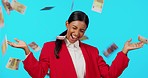 Business woman, money shower and studio with celebration, surprise and winning by blue background. Indian businesswoman, cash rain and happiness for profit, bonus and financial success by backdrop