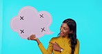 Happy, chat and pointing woman to a speech bubble isolated on a blue background in a studio. Smile, social media and a face portrait of a girl showing a board with tracking markers and mockup