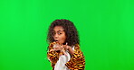 Face, girl and tiger costume on green screen in studio isolated on a background mockup. Portrait, playful and kid or child in a onesie pretending to be an animal for halloween, playing and happiness.