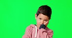 Moody, face and child in a studio with green screen with a upset, bad and spoilt attitude. Sad, down and portrait of boy kid model with sulk face expression and hand gesture by chroma key background.