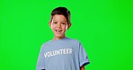 Green screen, volunteer and child with smile for help, charity and community service in studio. Volunteering mockup, support and portrait of boy with words on shirt for ngo, nonprofit and activism