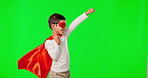 Flying, superhero and playing with child on green screen mockup for halloween, costume and fantasy. Games, freedom and creative with young boy on studio background for peace, fighter and pose