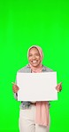 Board, face and woman in a studio with green screen with mockup space for advertising or marketing. Happy, smile and portrait of a muslim female model with a blank poster by a chroma key background.