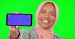 Showing, mockup and phone screen of a Muslim woman isolated on a studio background. Tracking markers, happy and an Islamic girl holding a mobile with blank space for promotion, marketing and branding