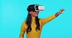 Virtual reality, reaching and woman on blue background for futuristic ai, cyberspace and metaverse. Technology, ux and hands of girl with vr glasses in studio for internet, website and online gaming