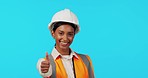 Happy woman, architect and thumbs up in studio for success or good job in construction against a blue background. Portrait of female engineer smile showing thumb emoji, yes sign or like on mockup