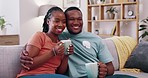 Love, relax and black couple on couch, coffee and romantic with happiness, quality time and bonding. Romance, man and woman on sofa, tea or cappuccino with people watching tv, loving or happy in home