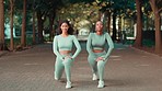 Fitness, park and friends stretching their legs before a run for marathon or race training in nature. Health, sports and portrait of female athletes doing warm up exercise for outdoor cardio workout.