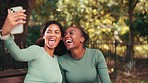 Fitness women, park selfie and together with funny face, kiss or relax on bench with social media at training. Woman, runner team and photography for profile picture, post or laugh in nature together