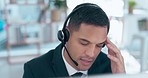 Businessman, call center and headache in frustration consulting in customer service or support at office. Tired and annoyed man consultant or agent talking to difficult client for online advice