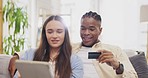 Tablet, couple and credit card for online shopping in home on sofa, payment or digital banking. Interracial, ecommerce and happy black man and woman with technology for fintech, sales app or finance.