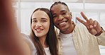 Peace sign, face selfie and couple kiss in home taking profile picture for happy memory. Portrait, interracial and funny black man and woman take photo, kissing cheek and tongue out for social media