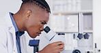 Science, microscope and medical with a doctor man at work in a laboratory for innovation or breakthrough. Research, sample and zoom with an african male scientist working in a lab for an experiment