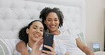 Phone, bed and happy couple of friends relax with social media post, funny meme or reading internet blog at home. Young gen z woman or lesbian people talking of lgbtq love, care and chat in bedroom