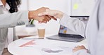 Closeup, laptop or business people with a handshake in job interview for negotiations in office meeting. Digital agency partnership, b2b collaboration or women in a successful agreement shaking hands