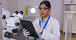 Medical science, woman and laboratory for research on tablet for futuristic innovation and development. Professional female scientist in a lab with technology to study analysis, results or data