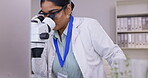 Microscope, research and scientist woman in laboratory, plants analysis and natural medicine or pharmaceutical test. Virus, bacteria and science person, digital tech and check for sustainable growth