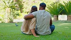 Back, love and couple on grass, hug and bonding for romance, relationship and talking. Partners, man and woman in the backyard, chilling and romantic on break, embrace and summer vacation in garden 