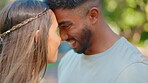 Love, face touch and happy couple at park for quality time, trust and relax in sunshine. Young man, woman and heads together for care, support and commitment to relationship, romance and outdoor date