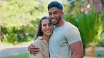 Park, love and face of happy interracial couple for bonding, quality time and relax on weekend date. Relationship, dating and portrait of man and woman hug together for trust, commitment and romance