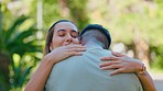 Hug, love and happy interracial couple in park for bonding, quality time and relax on weekend date. Nature, dating and man and woman embrace, hugging and together for trust, commitment and romance