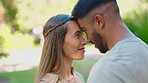 Park, love and face of happy interracial couple for bonding, quality time and relax on weekend date. Relationship, dating and man and woman together for intimacy, commitment and romance in nature