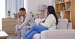 Marriage crisis, conflict, couple on sofa with problem fight in living room of home with anger and shouting. Divorce discussion, woman and man on couch in sad, angry argument with drama or depression