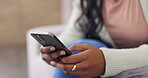 Woman, hands and smartphone for social media in living room, couch and digital texting for online post. Closeup, female user and typing on cellphone in house, download mobile app and scroll to relax