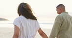 Happy, love and holding hands with couple on beach for romance, bonding and affectionate. Relax, holiday and summer vacation with man and woman walking on date for happiness, support and care