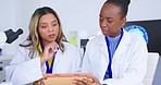 Scientist team, women and analysis of results with tablet for science study and medical research collaboration. Female in discussion in laboratory, scientific innovation and teamwork with experiment 