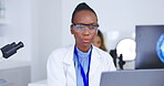 Science, idea and laptop with a doctor woman at work in a laboratory for research or innovation. Medical, microscope and thinking with a black female scientist working in a lab for development
