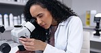 Science, woman and microscope with analysis in lab, scientist does experiment and biotechnology. Female doctor, analyze specimen and focus with scientific study and medical research in laboratory