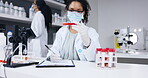 Scientist writing, clipboard and blood test tube for covid research in laboratory, information or results. Checklist, science and woman with sample for medical analysis, write notes and dna testing.