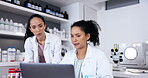 Teamwork, science on a laptop and a doctor woman at work in a laboratory with a colleague. Collaboration, research or innovation with a scientist and partner working together in a lab for analysis