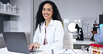 Laptop, smile and face of scientist typing in laboratory for online research or healthcare. Portrait, computer and happy woman, doctor or medical professional with pc for testing, science or analysis