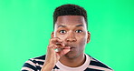 Portrait, secret and a black man on a green screen background in studio to zip his lips for silence. Face, quiet and mystery with a handsome young male making a promise to stay silent on chromakey