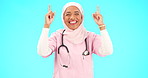 Muslim nurse, happy woman and pointing finger portrait with space for healthcare, religion or happiness. Islamic female medical worker with hand, smile and hijab for announcement on blue background