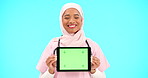 Woman, doctor and tablet green screen in studio for website information or medical record app. Muslim female or professional nurse in hijab and mobile device for online healthcare on blue background