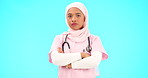 Face, nurse and Muslim woman shaking head in studio isolated on blue background mockup. Portrait, arms crossed and serious healthcare professional or Islamic person with disagreement, no or rejection