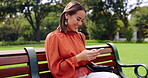 Relax, phone and smile with woman on park bench for social media, streaming and news, Internet, technology and digital with business female in outdoors for communication, commute and networking