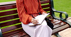 Park, bench and a woman writing in a notebook, diary or journal while outdoor in a garden to relax. Hands, inspiration and journalism with a female writer sitting outside in a natural environment