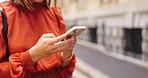 Hands, typing and phone in city for social media, online browsing or web scrolling in urban street. Cellphone, woman and person text messaging, networking on app and internet search outdoor in town.
