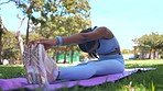 Pilates, stretching and female doing a exercise in nature for body, spirit and mental wellness. Fitness, health and Indian woman doing a warm up, yoga or meditation workout in a green garden or park.