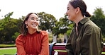 Friends, women and laughing at park on bench, bonding and talking together. Girls, outdoor and happiness of people in conversation, comic discussion or comedy and enjoying quality time for friendship