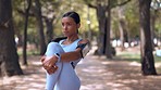 Fitness, stretching legs and woman at park for health, wellness and exercise. Sports, training and Indian athlete or person warm up or getting ready to start workout jog, cardio or running outdoor.