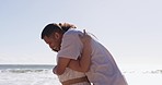 Greeting, hug and a couple at the beach for a date, surprise and fun at the sea. Happy, hello and a man hugging a woman with affection after missing in a long distance relationship at the ocean