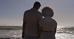 Back, love and a couple holding hands on the beach at sunset together for romance or dating outdoor. Nature, summer horizon or sea view with a man and woman bonding outside on the coast by the ocean