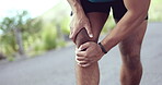 Injury, hurt and man with knee pain while training, exercise and workout outdoors with an emergency due to muscle discomfort. Fitness, accident and injured person or athlete with inflammation