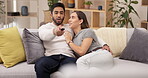 Couple relax on sofa, watching tv and talking, spending quality time together at home with love and comfort. Relationship, marriage and streaming online with remote control and happy people on couch 